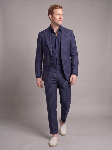 Navy pinstripe two-piece suit worn buttoned, full length, front view